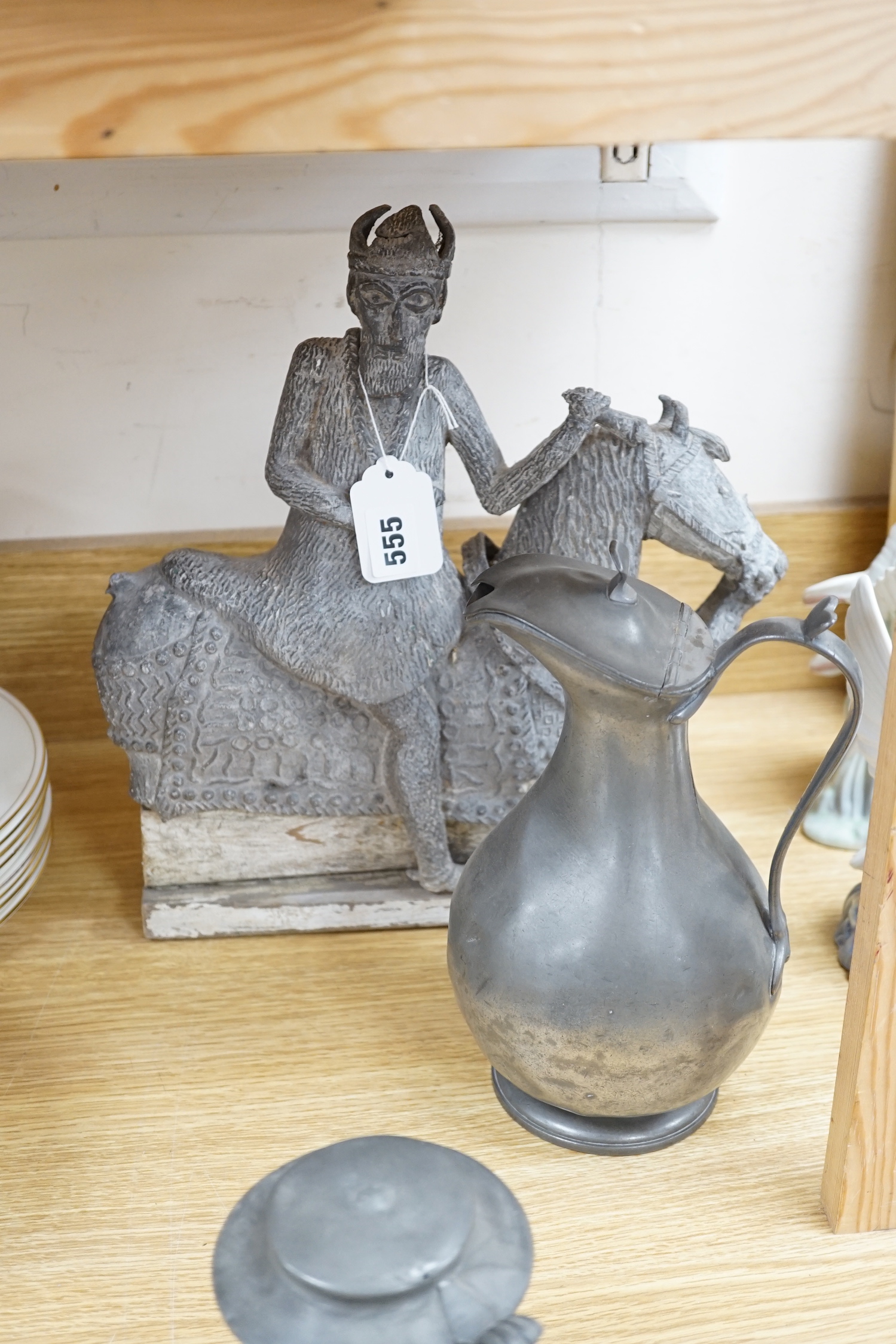 Six pewter items including an 18th-century Continental wriggle work tankard, two more tankards and two lidded jugs and a lead mounted figure of a Medieval king, lead figure 35cm high